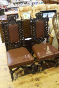 Pair Victorian carved oak and hide side chairs