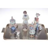 Four Lladro figures and Lladro cat and mouse