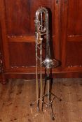 Vintage bass trombone with modern stand