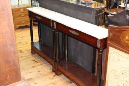 Pair of marble topped and brass mounted mahogany console tables,