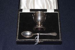 Cased silver christening egg cup and spoon