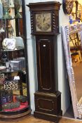 Jacobean style oak grandmother clock having square brass dial