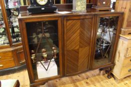 Early 20th Century mahogany shaped front cabinet bookcase on ball and claw legs