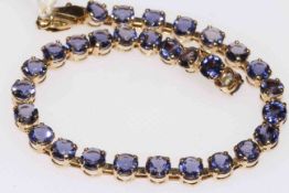 9 carat gold bracelet with sapphire blue colour stones