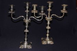 Pair Victorian silver three branch candelabra, the ornate columns with embossed sconces and foot,