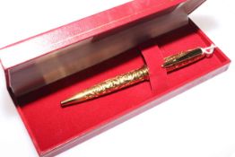 Les Must de Cartier ornate gilt ball point pen,
