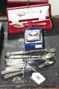 Cased silver spoon, silver handled servers and fruit knives,