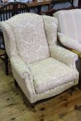 Laura Ashley wing chair in light foliate pattern fabric