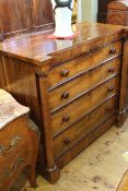 Mid 19th Century rosewood chest of four long graduated drawers with turned supports,