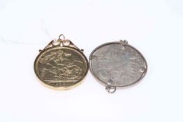 Two mounted coin pendants