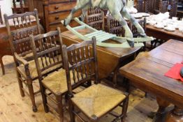 Set of six Lancashire spindle back rush seated chairs including pair carvers together with an oak