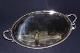 Victorian silver two handled oval tea tray, having beaded border and handles, London 1865,