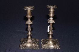 Two late Victorian silver ornate candlesticks,