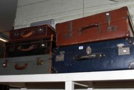 Five assorted vintage suitcases