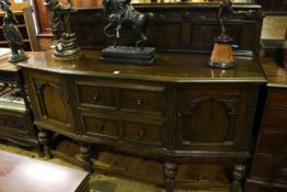 Early 20th Century carved oak breakfront sideboard with raised back,