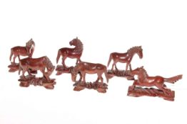 Six miniature carved wood horses