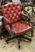 Red buttoned leather swivel desk chair