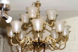 Large twelve branch brass centre ceiling light with frosted glass shades