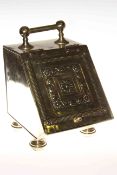 Brass coal scuttle with embossed lid