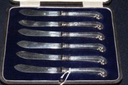 Cased set of silver pistol grip dessert knives,