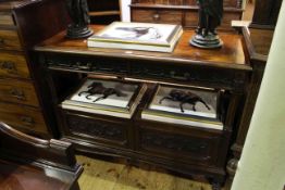 Early 20th Century carved mahogany buffet having to drawers above an open compartment with two