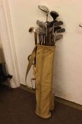 Vintage canvas gold bag and clubs including several with hickory shafts