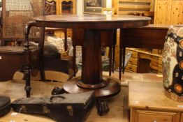 Victorian circular mahogany flip top table on paw feet