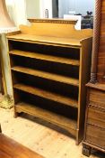 Medium oak open bookcase having three adjustable shelves,