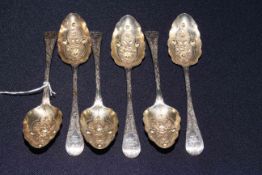 Set of six Georgian silver berry spoons with embossed bowls and chased handles