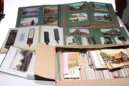 Large collection of postcards in six albums and loose