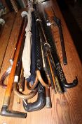 Collection of walking sticks, shooting stick, fishing rod, air rifle, two Firkin barrel measures,