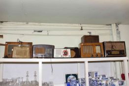 Collection of eight vintage wood and Bakelite radios including Philips, Ever Ready, Ultra, Ecko,