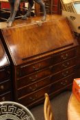 Reprodux mahogany five drawer bureau