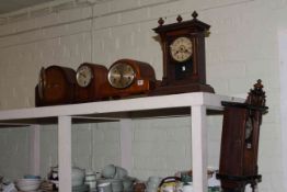 Small wall clock and four mantel clocks