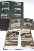 Four albums containing a collection of assorted postcards