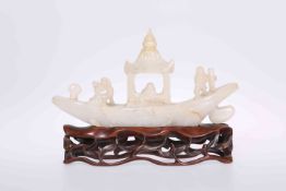 A CHINESE JADE CARVING OF A RIVER BOAT, PROBABLY EARLY 20TH CENTURY, the stone of grey-white hue,