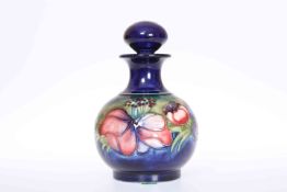 A MOORCROFT ANEMONE SCENT BOTTLE AND STOPPER,