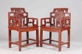 A PAIR OF CHINESE RED STAINED ELM ARMCHAIRS