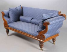 A VICTORIAN MAHOGANY AND UPHOLSTERED SETTEE, with scroll ends and turned feet, moving on castors.