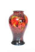 WILLIAM MOORCROFT A FLAMBE LEAF AND BERRY VASE, CIRCA 1930'S, of shouldered baluster form,
