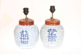 A PAIR OF CHINESE BLUE AND WHITE VASES, painted with peonies and happiness marks,