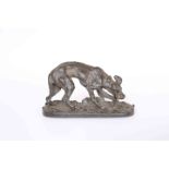 A BRONZE OF A DOG CHEWING ON A BONE, bears signature in the cast P.J. MENE.