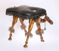 A MID 20TH CENTURY MIDDLE EASTERN "CAMEL" STOOL,