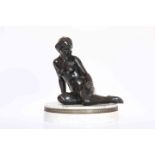 A FRENCH BRONZE FIGURE OF A RECLINING FEMALE NUDE, her left arm holding an apple,