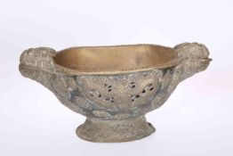 A BRASS MOUNTED WOODEN BOWL, with animal mask handles, applied with animal masks and flowerheads.