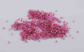 A COLLECTION OF LOOSE RUBIES, mostly round cut of varying sizes. Total weight 22.72cts.