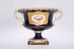 A ROYAL CROWN DERBY TWO-HANDLED VASE, CIRCA 1915, the pedestal body painted with a floral spray,