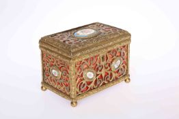 A CONTINENTAL BRASS AND PORCELAIN CASKET, 19TH CENTURY,