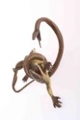 A COLD PAINTED BRONZE OF A SNAKE ATTACKING A LIZARD,