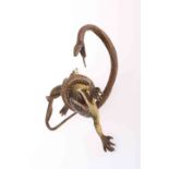 A COLD PAINTED BRONZE OF A SNAKE ATTACKING A LIZARD,